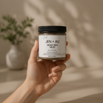 Hand holding jar