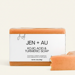 Jen + Au Kojic Acid & Turmeric Soap with cream background